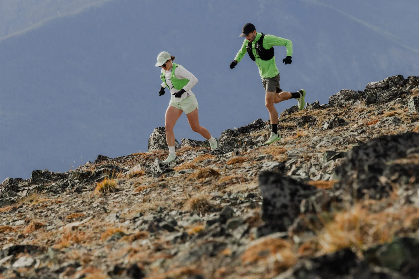 Trail runners on a rocky ridgeline